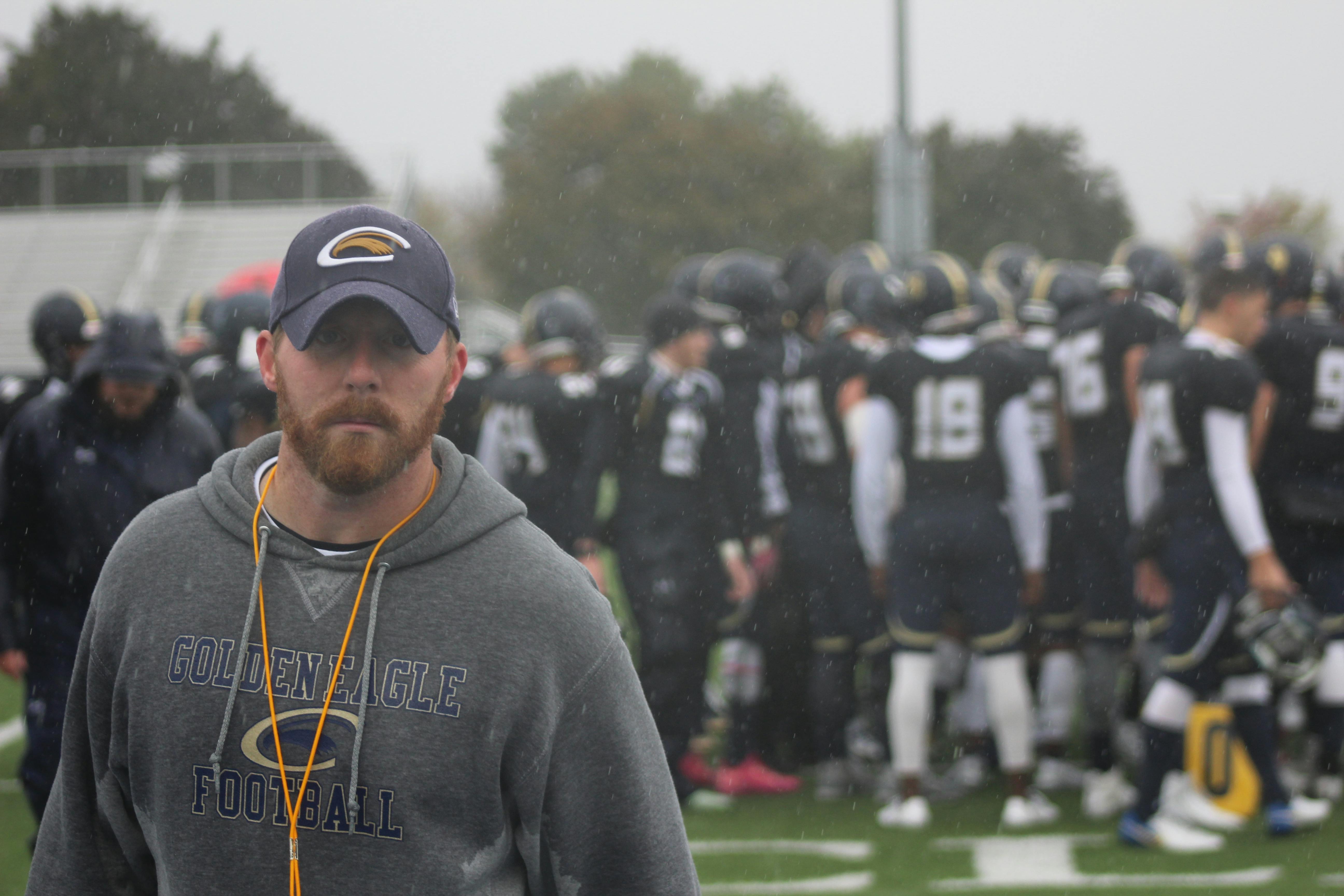 Coach with team members